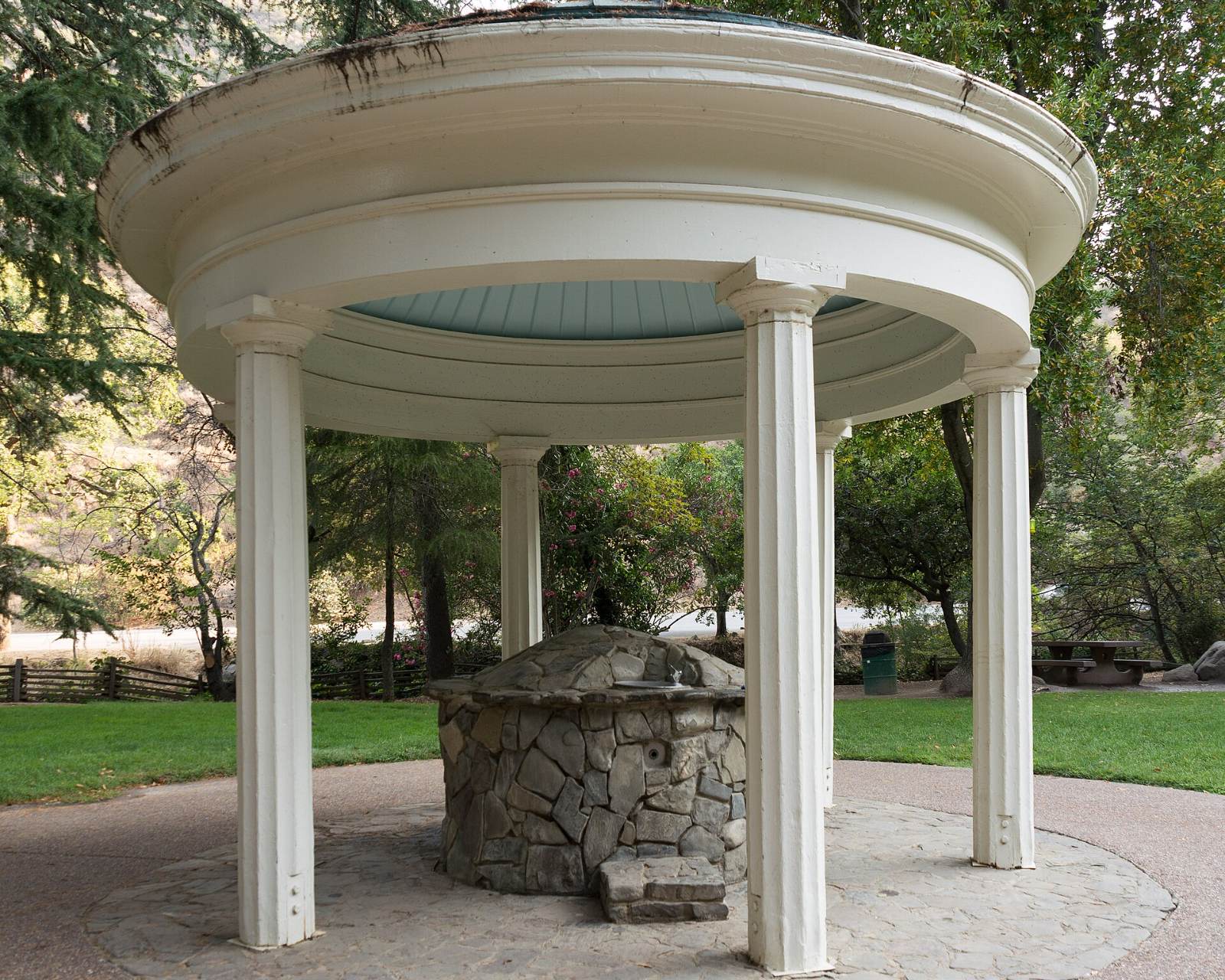 A white columned pavilion over an old mineral spring in Alum Rock Park