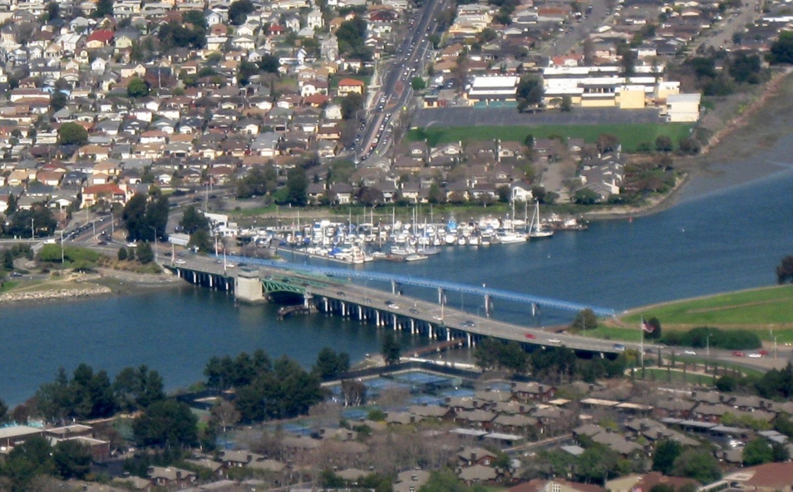 Aerial view of the Bay Farm Island Bridge crossing the channel to Alameda