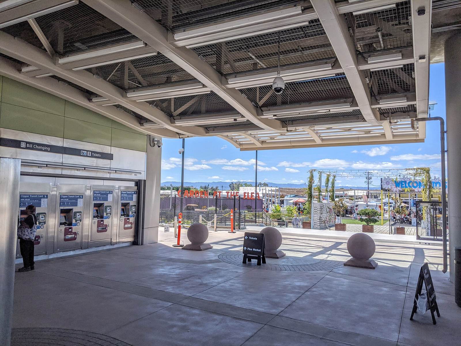 Rows of stalls at the San Jose Flea Market seen from the BART station