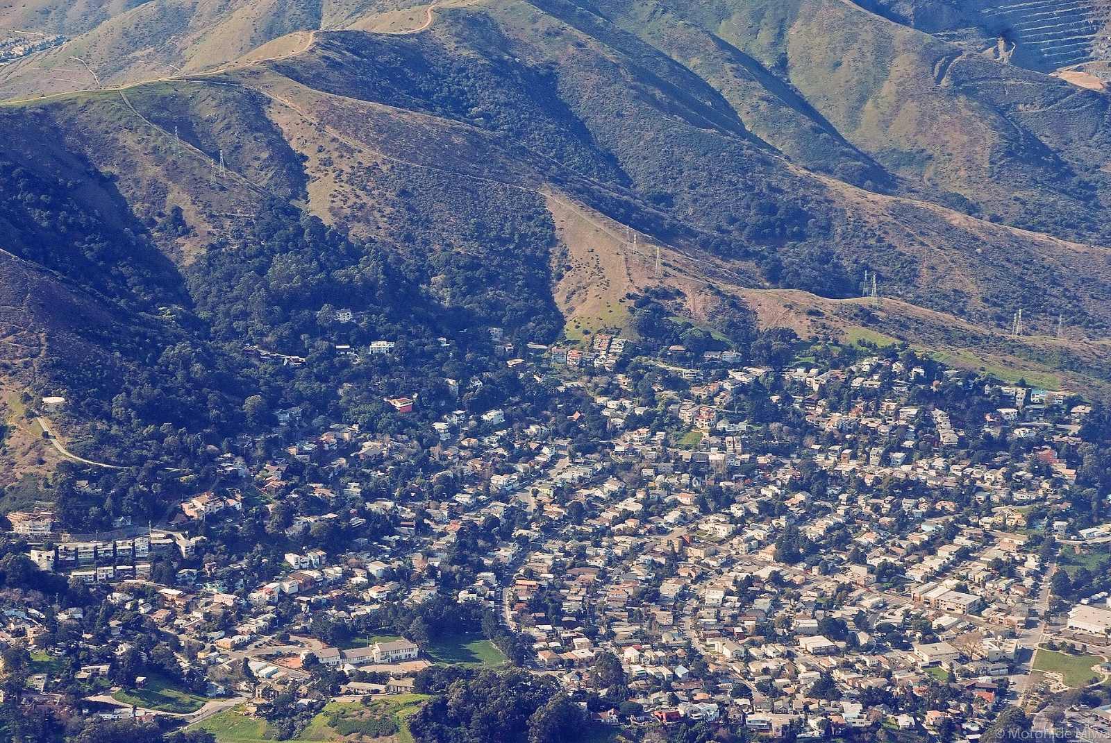 Homes in Brisbane spread across the slopes below San Bruno Mountain