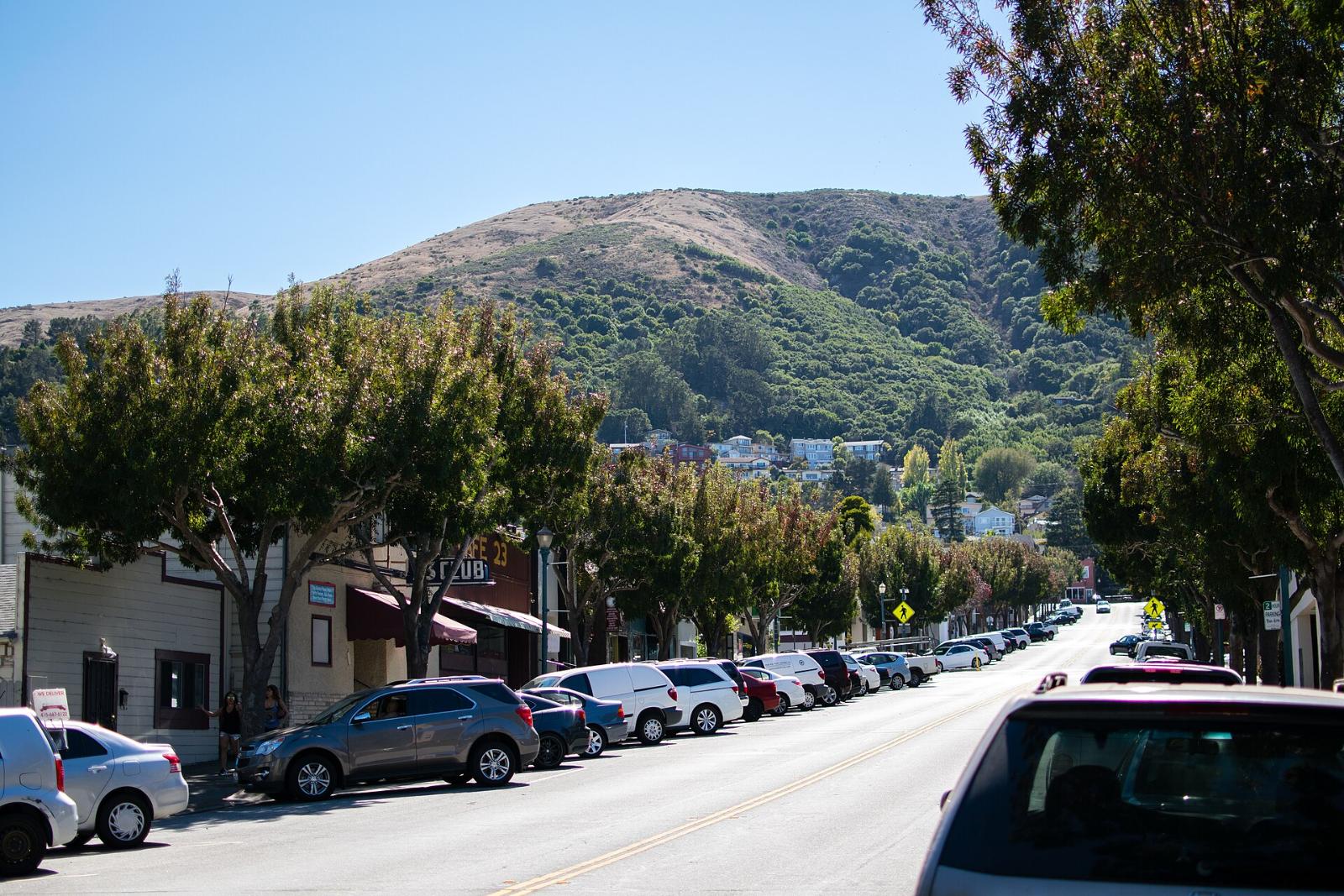 Visitacion Avenue in downtown Brisbane with San Bruno Mountain behind