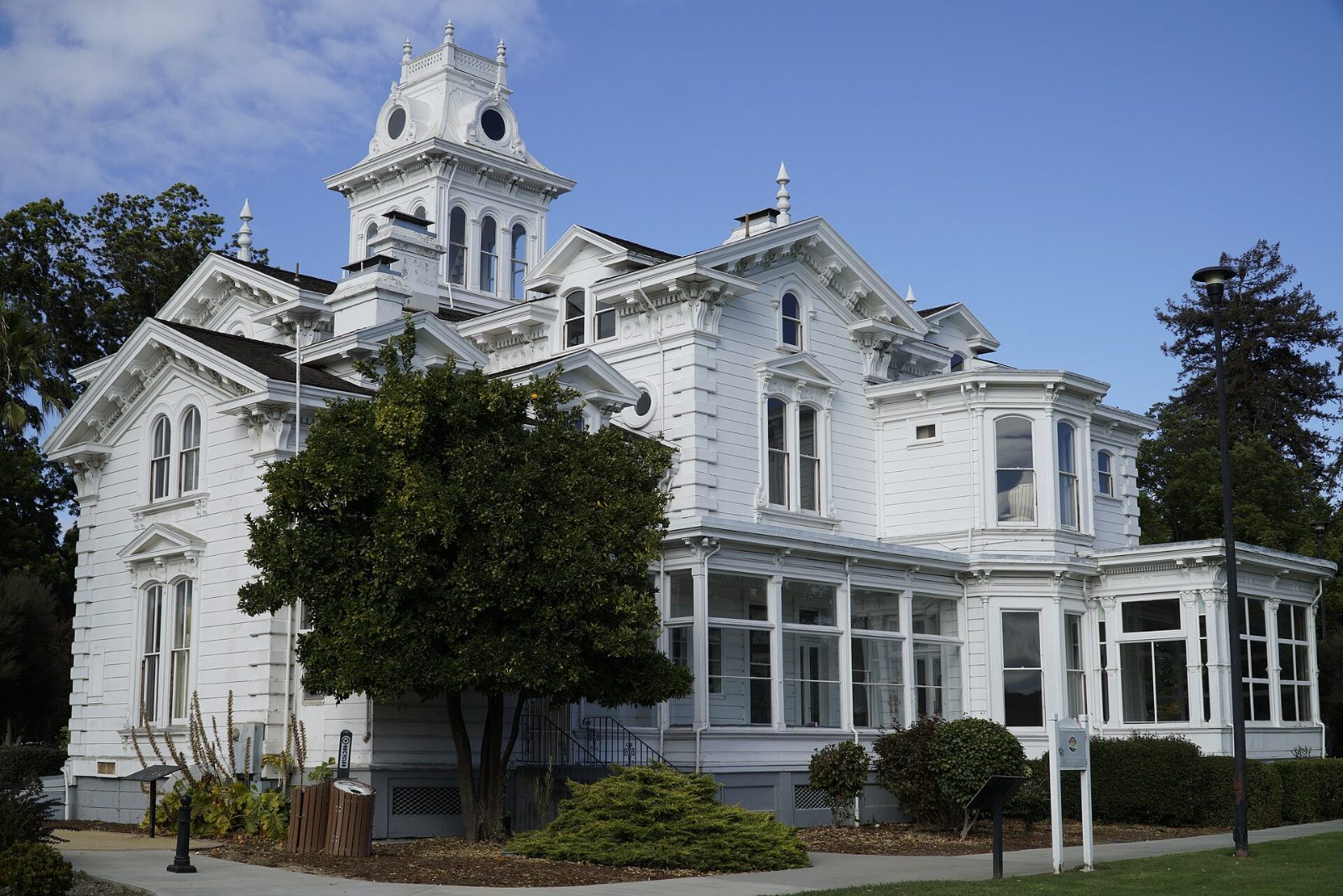 The white Meek Mansion with its central tower and mansard roof