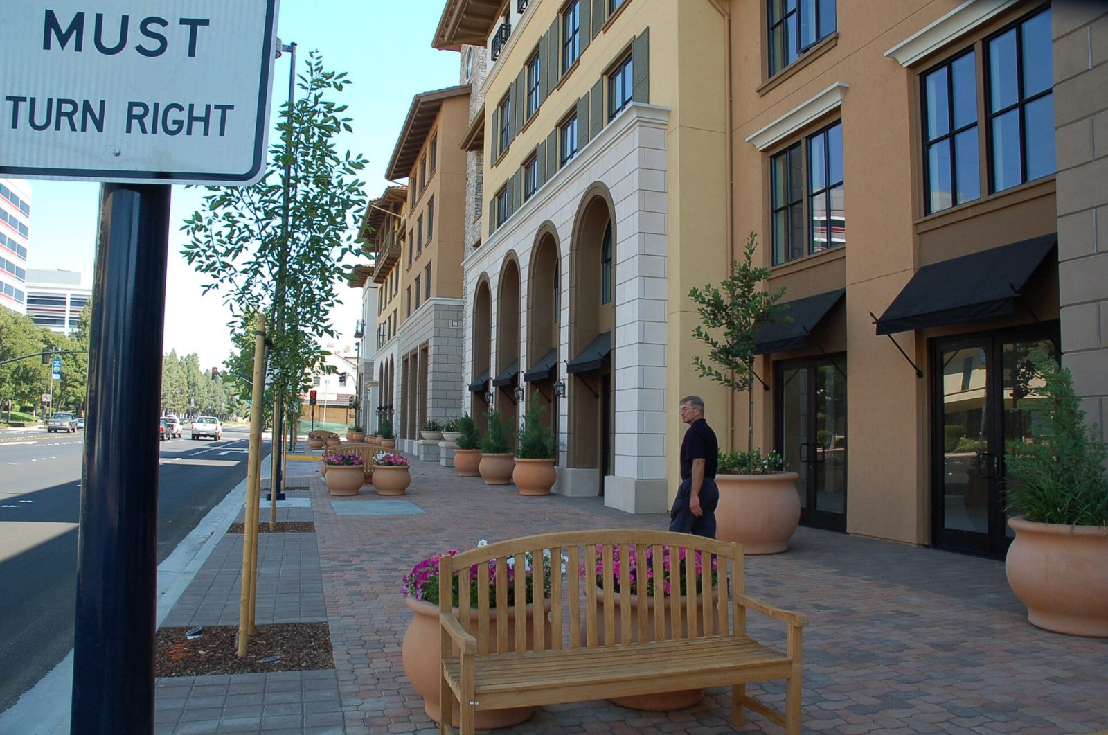 Arched walkways and benches along a building in downtown Concord
