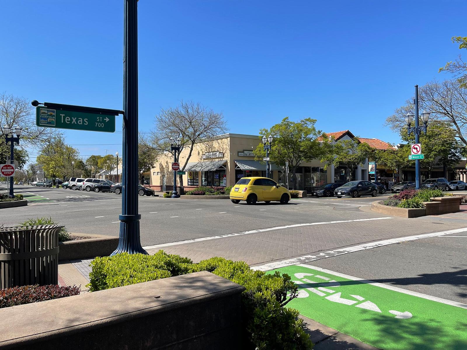 Storefronts and trees on a street in downtown Fairfield