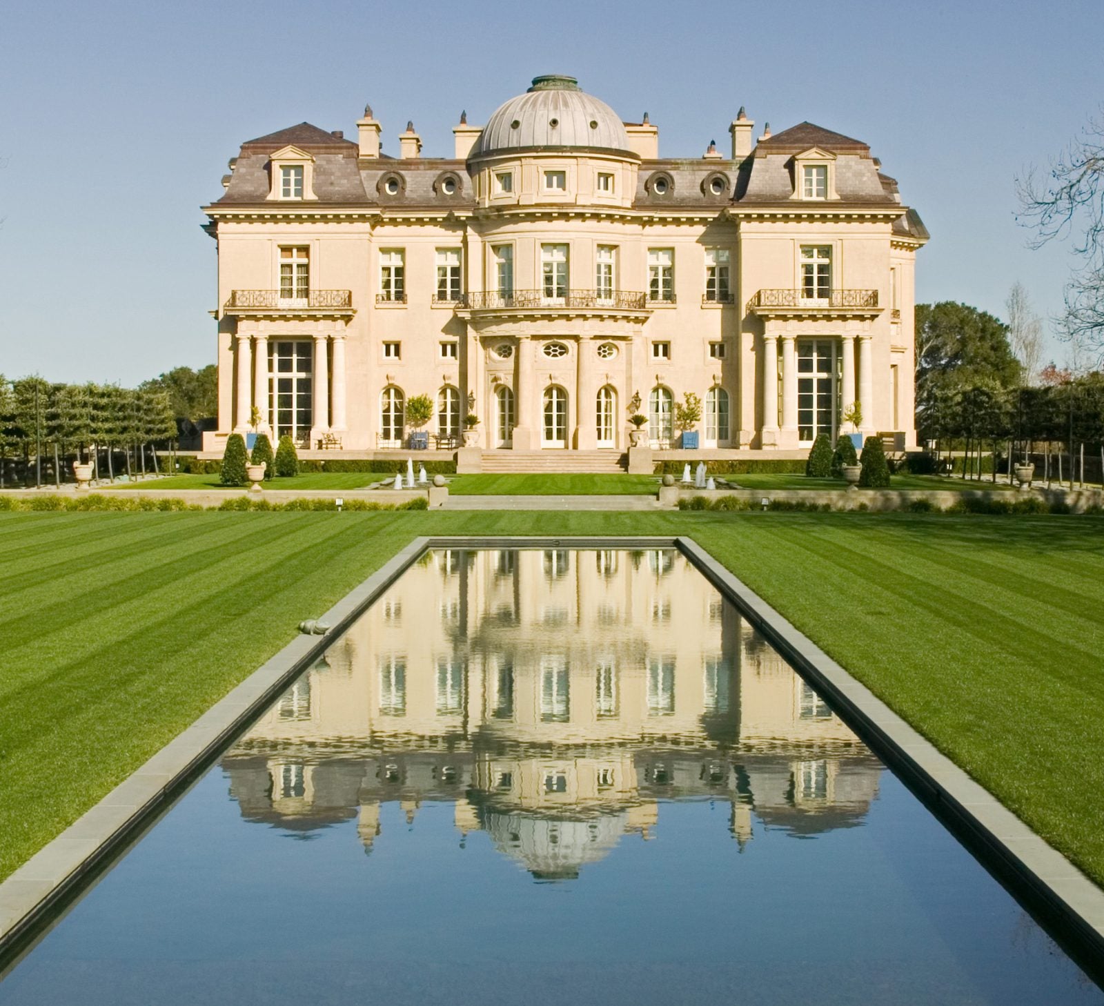 The Carolands chateau in Hillsborough reflected in a long formal pool