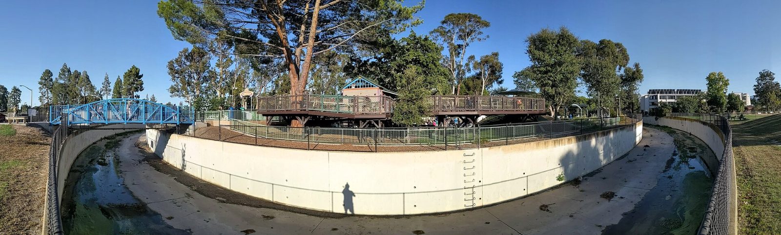 Adobe Creek running beside the Magic Bridge playground at Mitchell Park