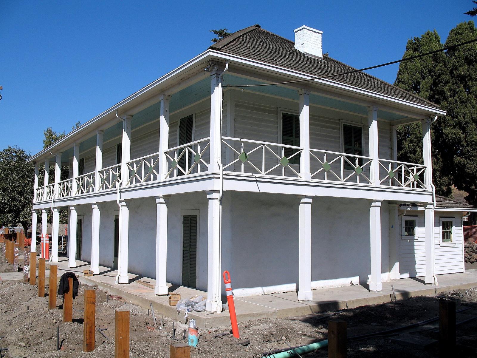 The two-story José María Alviso Adobe with its wooden balcony