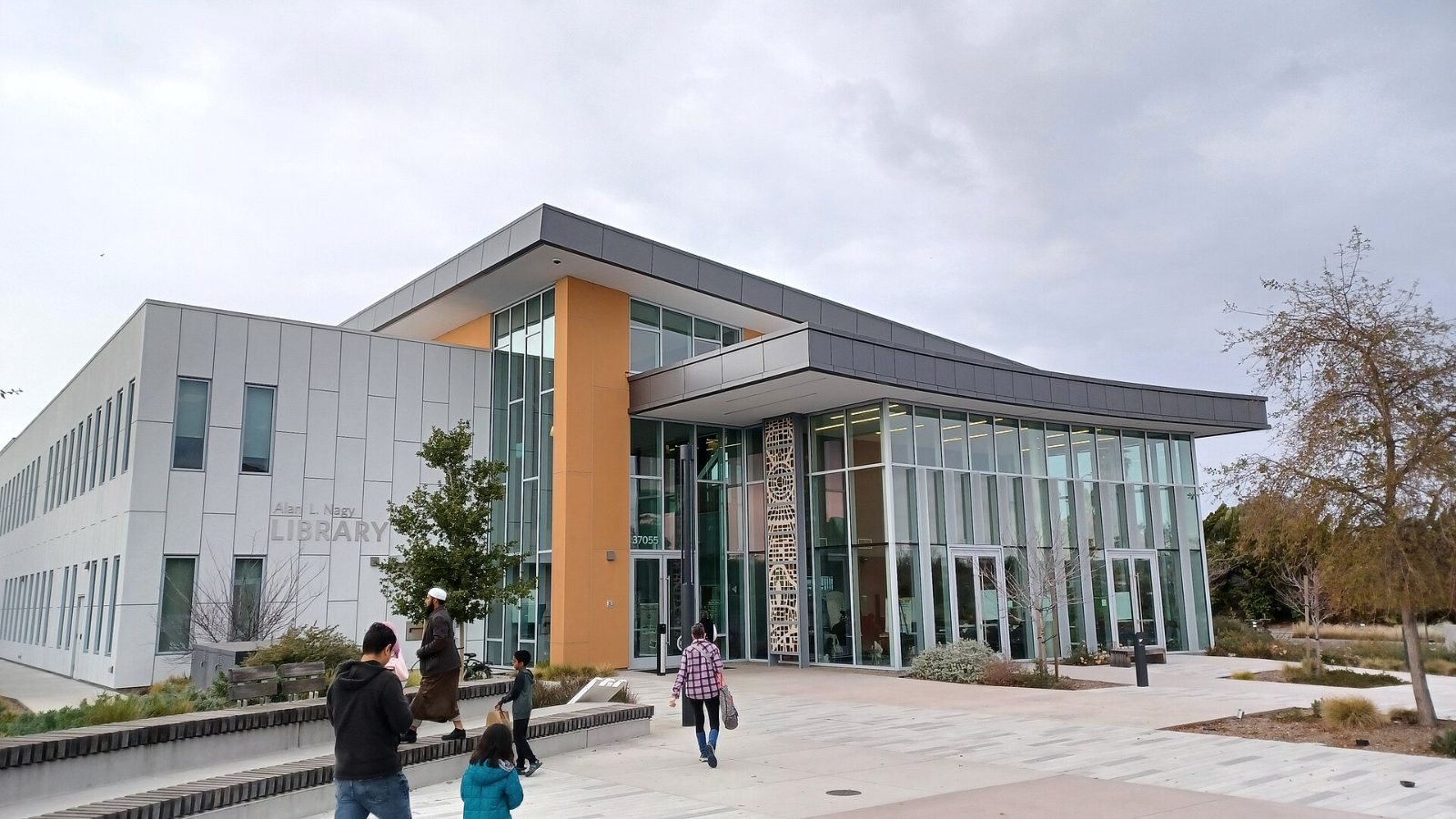 The modern glass and wood entrance of the Newark Library
