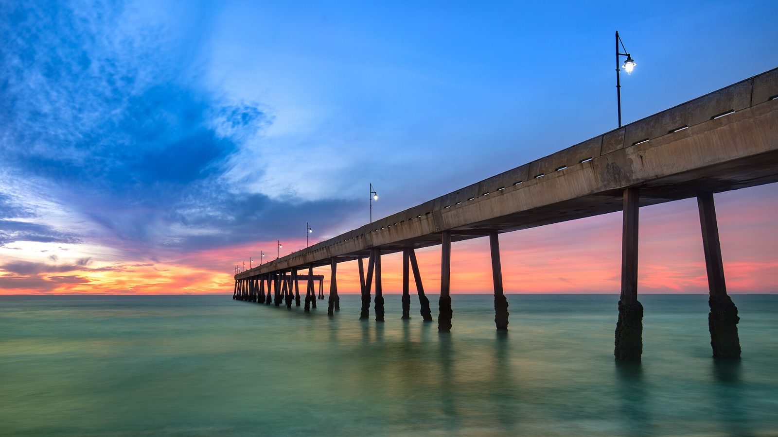 The Pacifica Pier stretching into the ocean at sunset