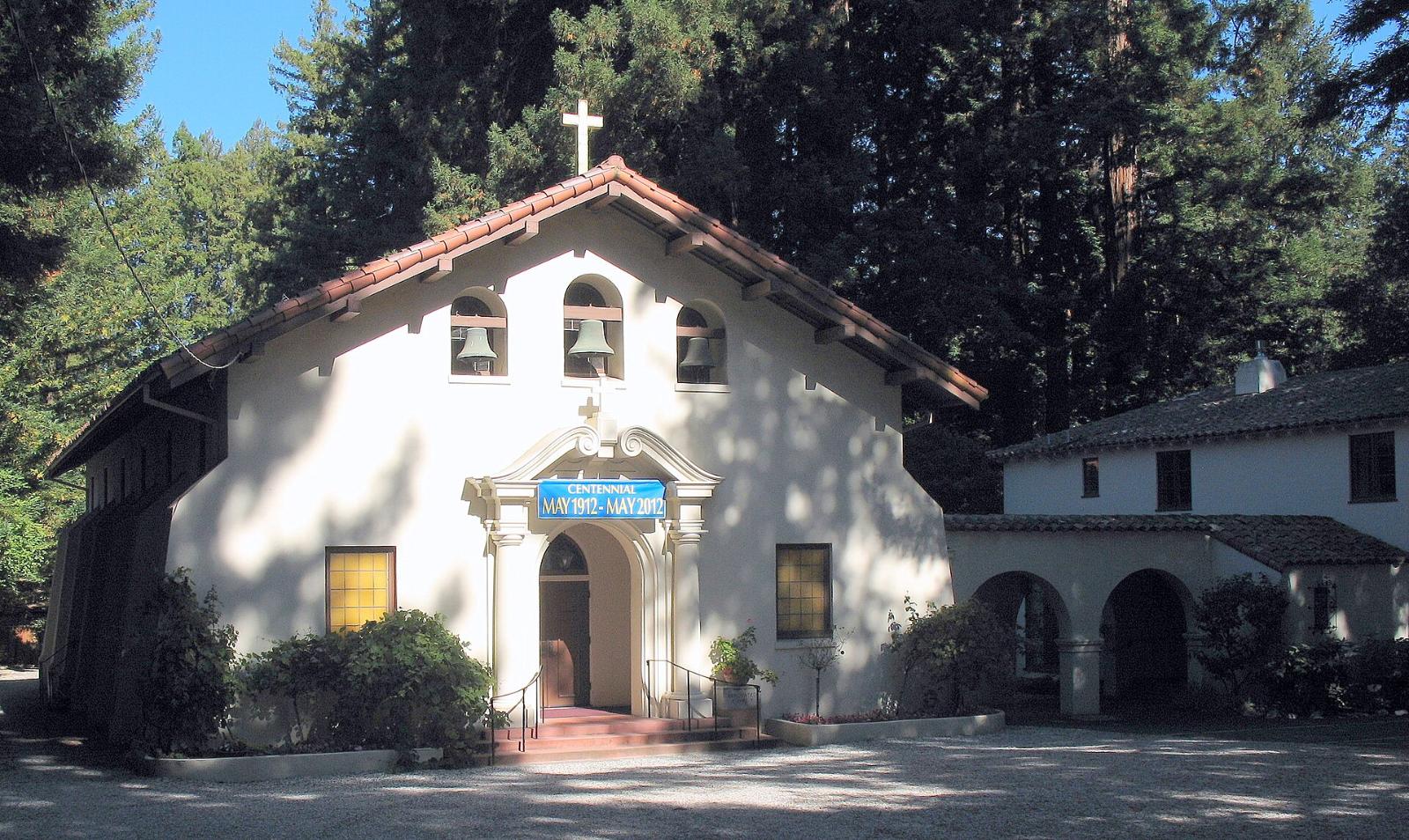 The white Mission Revival front of Our Lady of the Wayside church