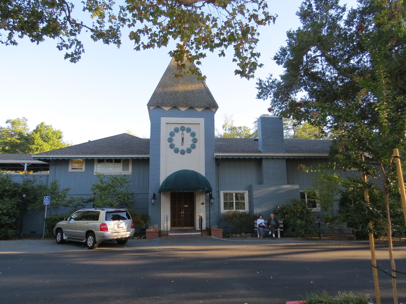 The front of the historic Stanley Dollar house with a clock tower in Rossmoor
