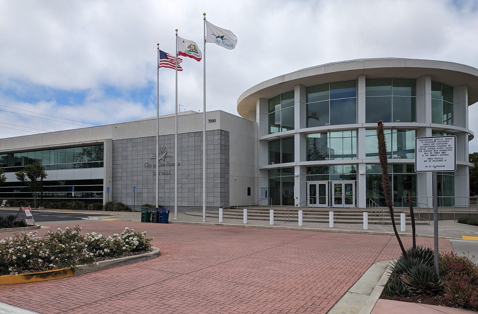 San Ramon City Hall with its curved glass front and flags