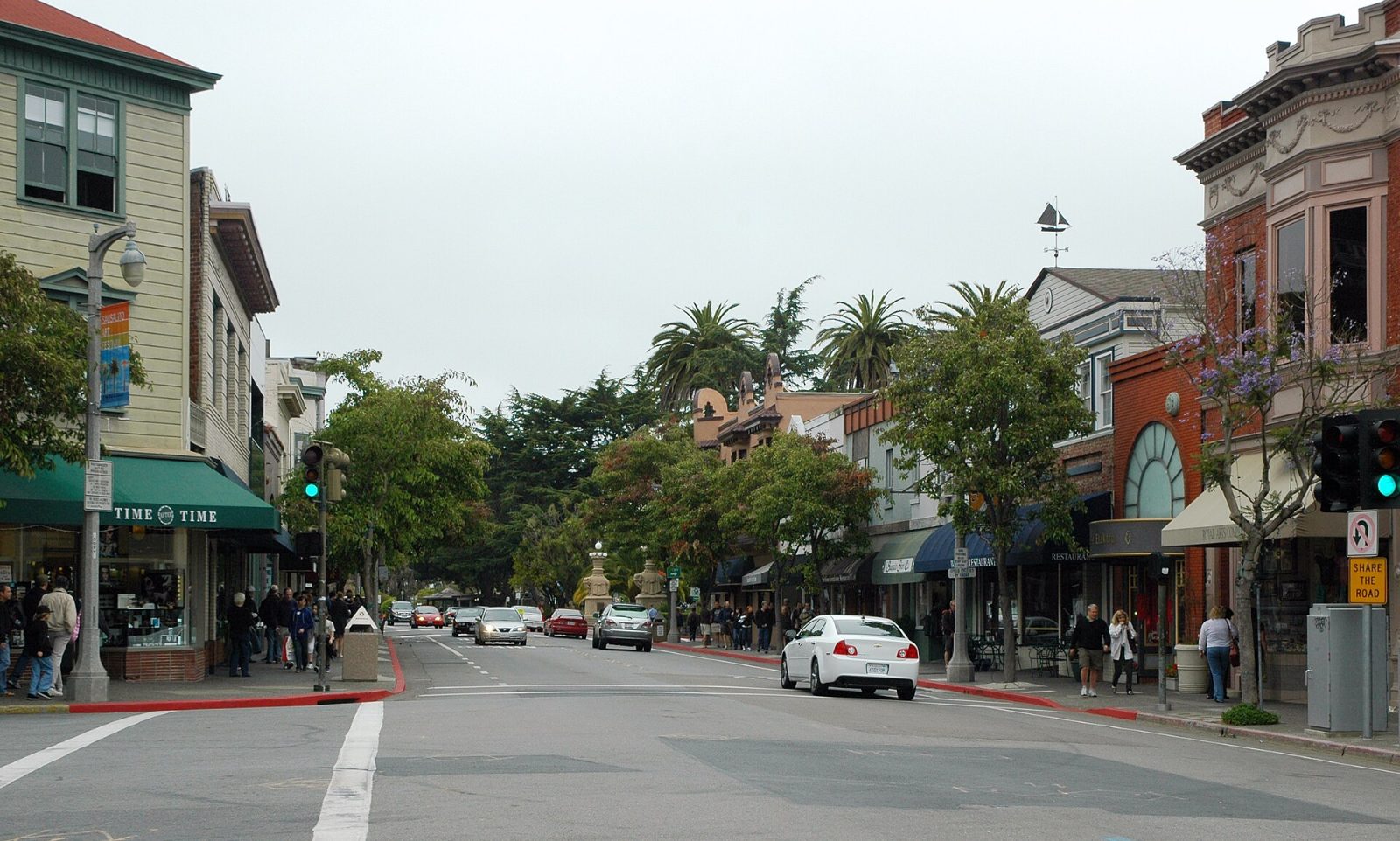 Shops and palm trees along Bridgeway at Princess Street in Sausalito