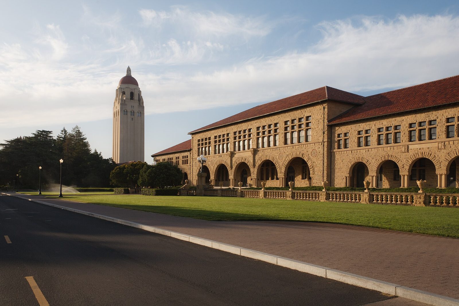 The sandstone arcades of the Main Quad with Hoover Tower behind
