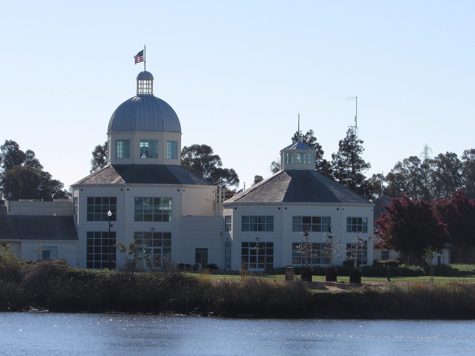 Suisun City Hall with its domed tower seen across the water of Suisun Slough