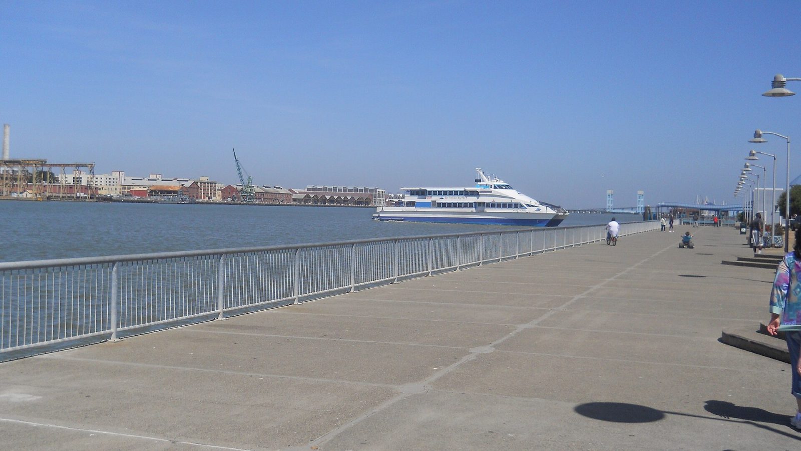 A ferry on the water seen from the Vallejo waterfront walkway