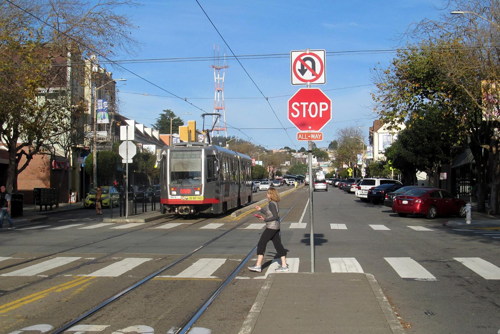 A Muni streetcar on West Portal Avenue at 14th Avenue in San Francisco